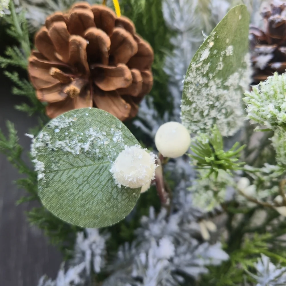 Handmade lush, artificial Winter Greenery Wreath With White And Brown Accents
